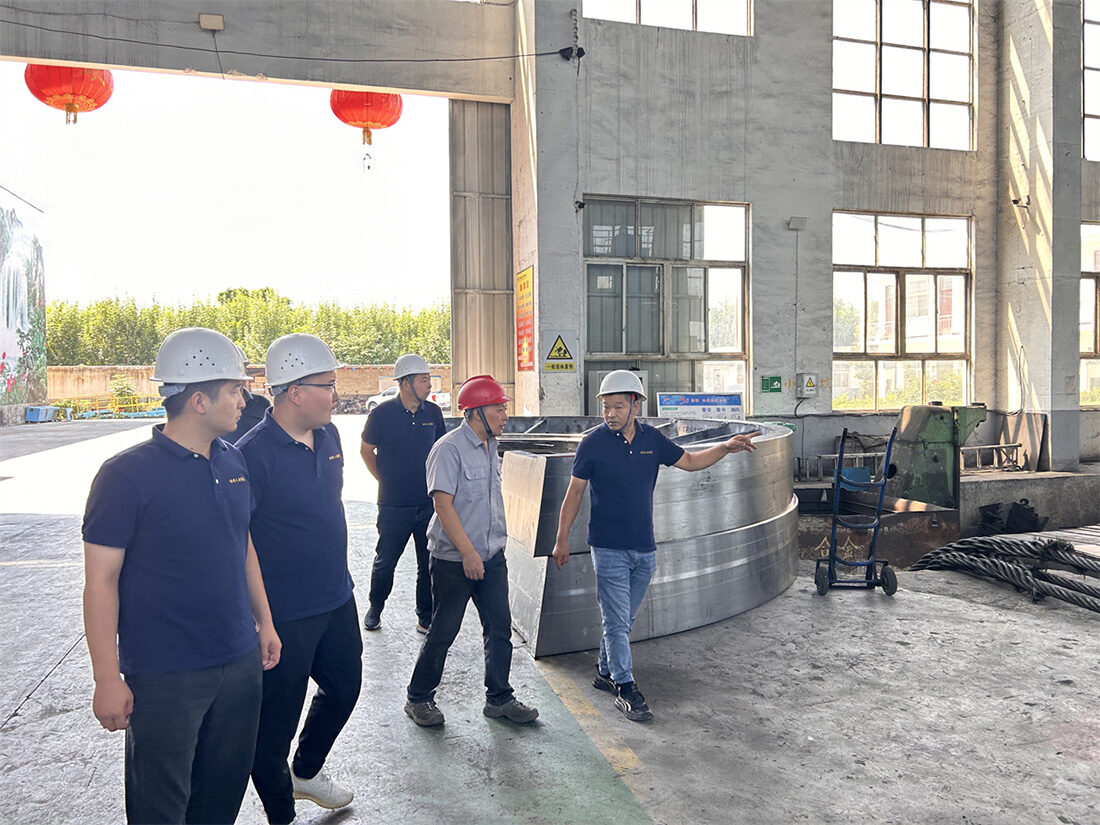 International buyers inspecting a large ring casting on our foundry floor