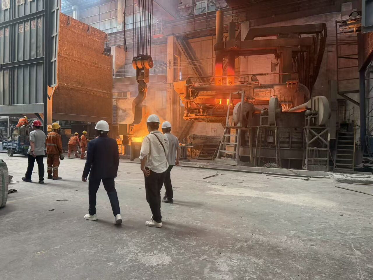 Customers watching molten steel pouring